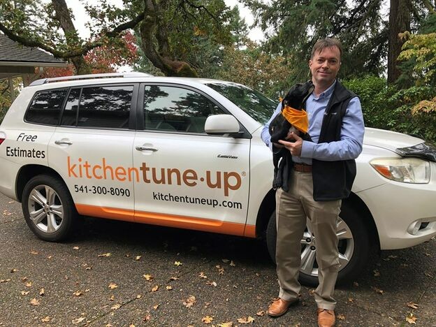 2019_12_Colin_McCarthy_outside_vehicle_with_dog_in_bandanna.jpg